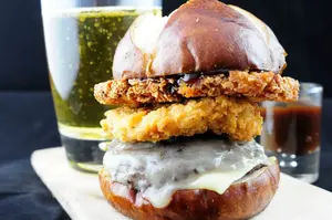 This burger features custom-blend beef, crispy fried chicken