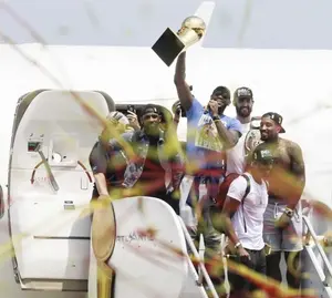 NBA champion Cleveland Cavaliers Lebron James, center, holds