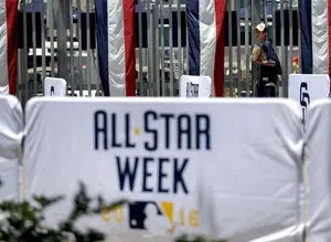 A fan waits to enter Petco Park prior