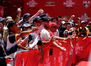 Fans ask for autographs as players arrive at