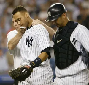 New York Yankees trainer Gene Monahan, left, and