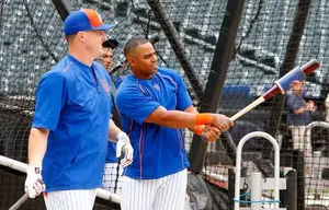 Jay Bruce #19 and Yoenis Cespedes #52 of