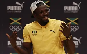 Usain Bolt speaks during a Jamaican Olympic Association and Puma press conference at the Cidade Das Artes in Rio de Janeiro on August 8, 2016. / AFP PHOTO / Adrian DENNIS