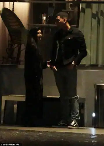 Low-key: The pair seemed relaxed as they caught up with one another 