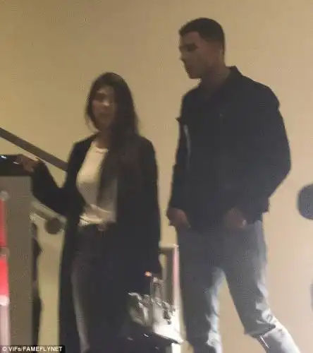Paying her fare? Kardashian appeared to have a valet ticket in hand  