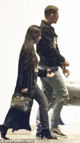 Gorgeous: Dressed in her effortlessly stylish best, the reality star wore s3xy black heels, a long black duster and carried a chic handbag