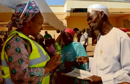 Pic.2. Executive Secretary, Pension Transitional Arrangement Directorate (PTAD), Sharon Ikeazor (L) interacting with a pensioner during the on-going Pension Verification Exercise in Yola. Photo/Ernest Okorie/