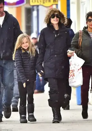 Quality time: The pair looked happy to be spending a relaxing afternoon away from the slopes as they chatted animatedly on their way into town