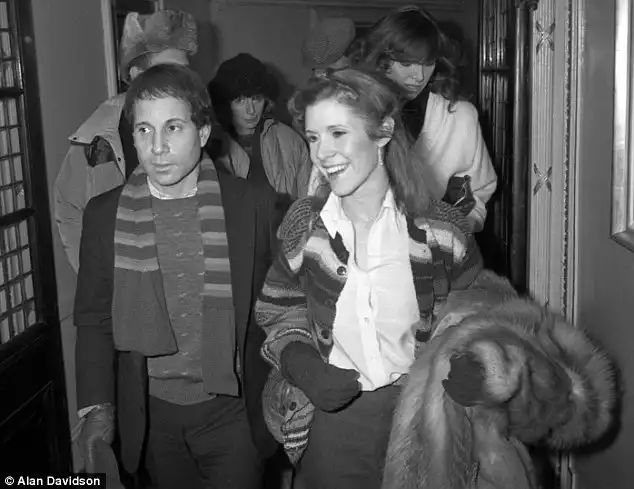 Moved on: Following her break-up with Aykroyd, Fisher returned to singer and songwriter Paul Simon whom she had previously dated. The two wed in 1983 but split just under a year later