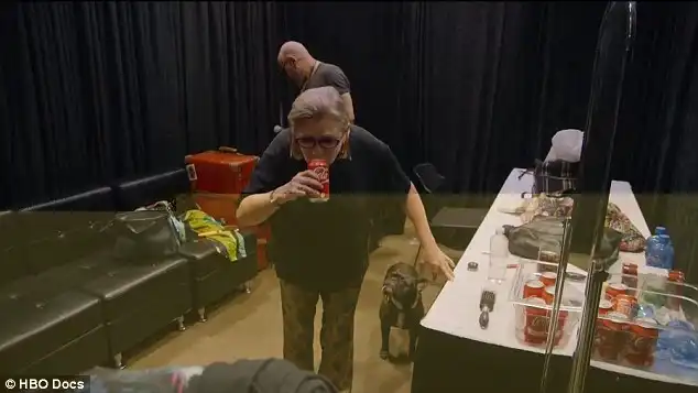 Energy boost: The late actress recharged with a soft drink behind-the-scenes at a collector's convention