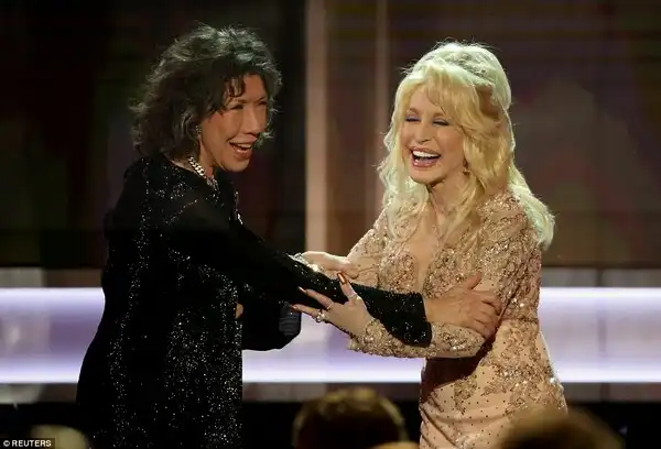 BFFs: She was presented with the prize by good pal Dolly Parton