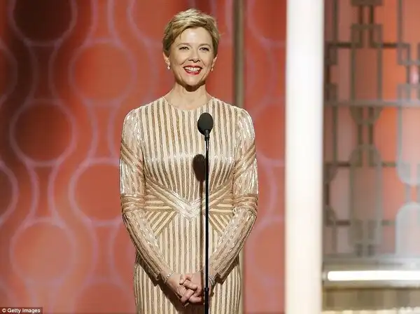 Legend: Anette Benning looked lovely as she presented in a gold number
