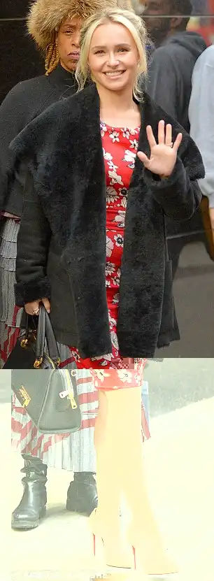 Flower power: Hayden looked ready for summer in a red dress patterned with white blossoms adding a faux fur jacket for warmth on the chilly winter day