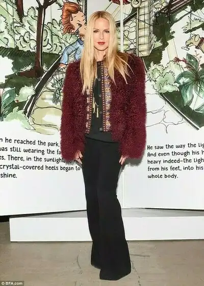 A nice winter look: The blonde TV star wore a maroon fuzzy coat over a patterned shirt