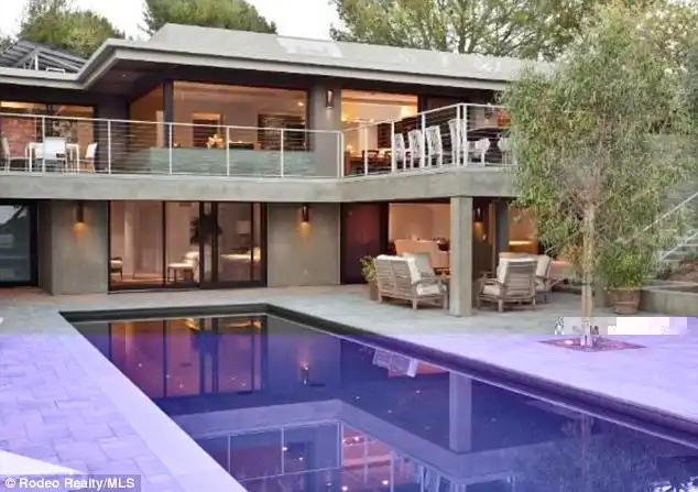 Iconic: The contemporary-style home that has an outdoor pool is located on Carla Ridge in the heart of the prestigious and iconic 90210 ZIP code