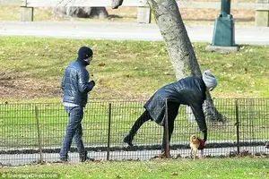 Man's best friend: Jennifer appeared to keep a close eye on her beloved dog as she was seen scooping her up and putting her down on a number of occasions