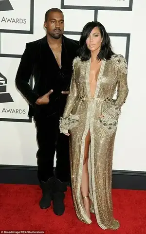 Making a statement: Kanye Westseen at the Grammys in 2015 with wife Kim Kardashianis refusing to attend this year's awards show, despite eight nominations