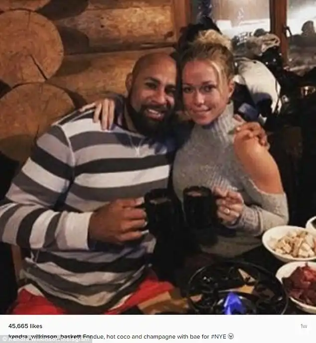 Beaming: She recently returned from another holidaythis time with her husband Hank Baskett; they rang in the New Year in Whistler, Canada