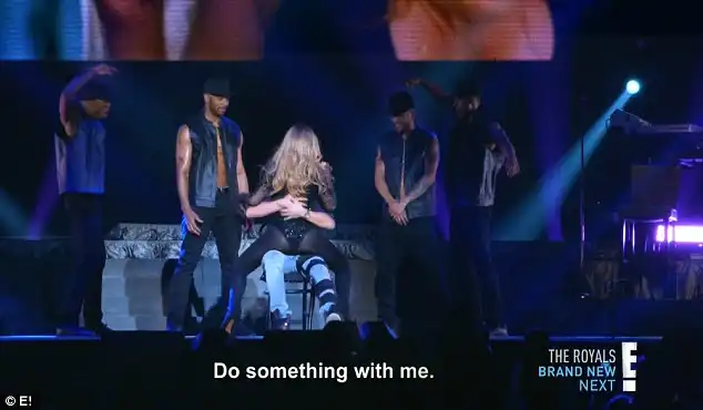 Touching it: Tanaka wrapped his arms around Mariah as she gave him a lap dance while performing Touch My Body