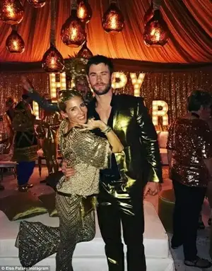 'Golden New Year with the family!' Chris Hemsworth (R) and his wife Elsa (L) also attended