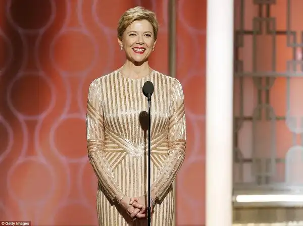 Legend: Anette Benning looked lovely as she presented in a gold number
