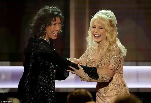 BFFs: She was presented with the prize by good pal Dolly Parton