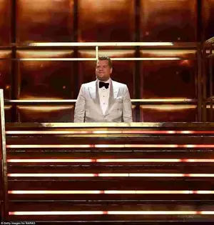 Funny: James Corden began his opening monologue by getting stuck on the lift