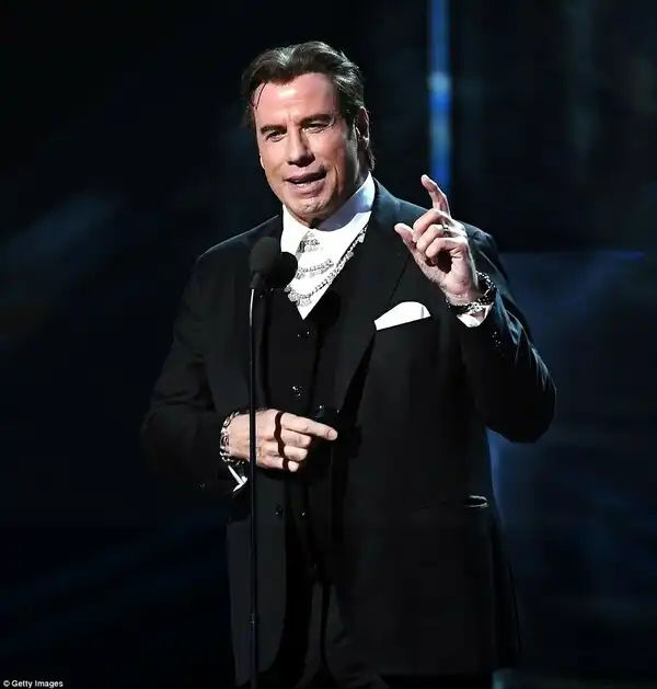 Big role: John Travolta introduced one of the musical acts