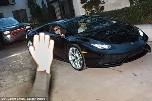 Wished her on her way: A group of well-wishers had been waiting for her outside the upscale rental where she'd been staying