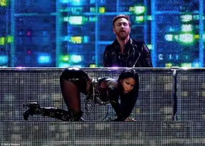 Wow factor: She posed on all fours while famous DJ David Guetta spun on the ones and twos