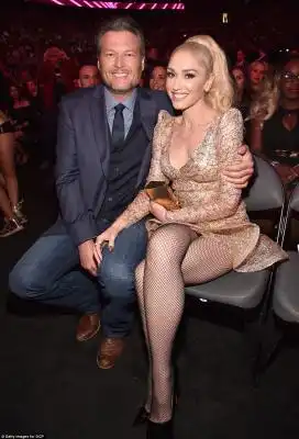 Loved up: Before the big win, the two were pictured enjoying each other's company in the audience