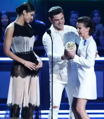 Overcome: The British youngster teared up as she collected her award from Zac Efron and Alexandra Daddario