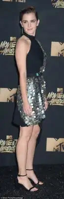 Stylish: The pretty actress wore her hair up and rocked a black and silver mini dress that had one sleeve and paired semi sheer panels with large statement sequins