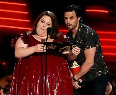 Working for his supper: Ventimiglia pulled double duty as a presenter joining This Is Us co-star Chrissy Metz on stage
