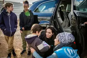 Help: Angelina Jolie has instilled her unwavering desire to help those in need onto her own family as daughters Shiloh, 11, and Zahara, 13, joined their mother during a tour of the Zataari refugee camp in Jordan on Sunday