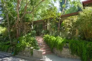 Tony hood: The 2,563-square-foot, three bedroom, 2.5-bathroom ranch home is one of two in the tony neighborhood of Nicols Canyon owned by the actress