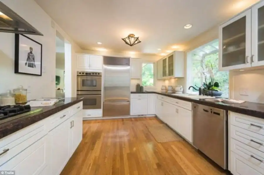 Calling all chefs! The kitchen is fitted with Bosch, Gaggenau and Sub-Zero appliances, and there’s a fireplace in the living room
