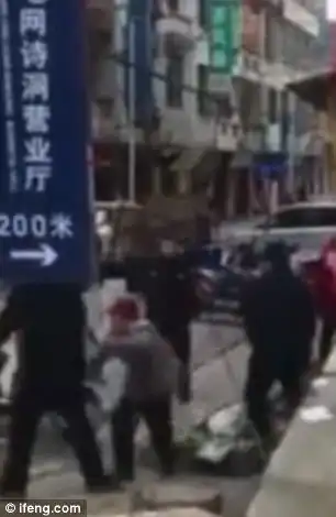 They try to drag her onto a police car but she refuses