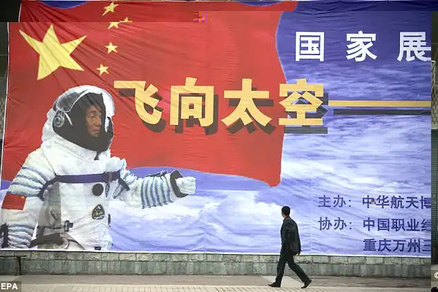 Beijing sees its space programme as symbolising the country's progress and a marker of its rising global stature. A pedestrian is pictured walking past a propaganda post in Shanghai 