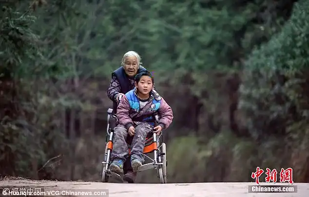 Dedication: Shi Yuying (pictured) has pushed her grandson Jiang Haowen to school for four years. In order to do so, the 76-year-old has to walk a total of 15 miles a day in rural China