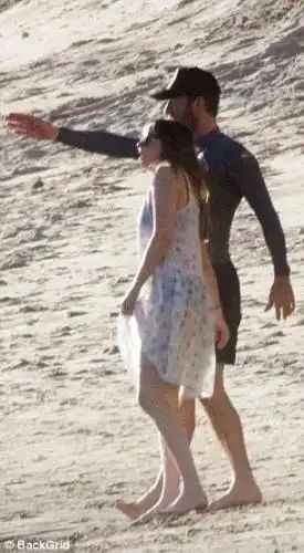 Inseparable: The artist appeared to point something out to the actress mid-stroll