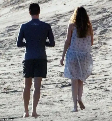 Heading back: After their PDA session, the lovebirds were seen leaving the beach