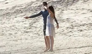Having a moment together: The lovebirds chatted it up on the beach