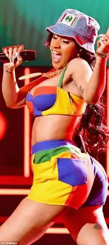 When you got it, flaunt it: Cardi, who shot to fame last year on the tide of her hit single Bodak Yellow, showed off her legs in a pair of high-waisted blue, crimson, yellow and green shorts