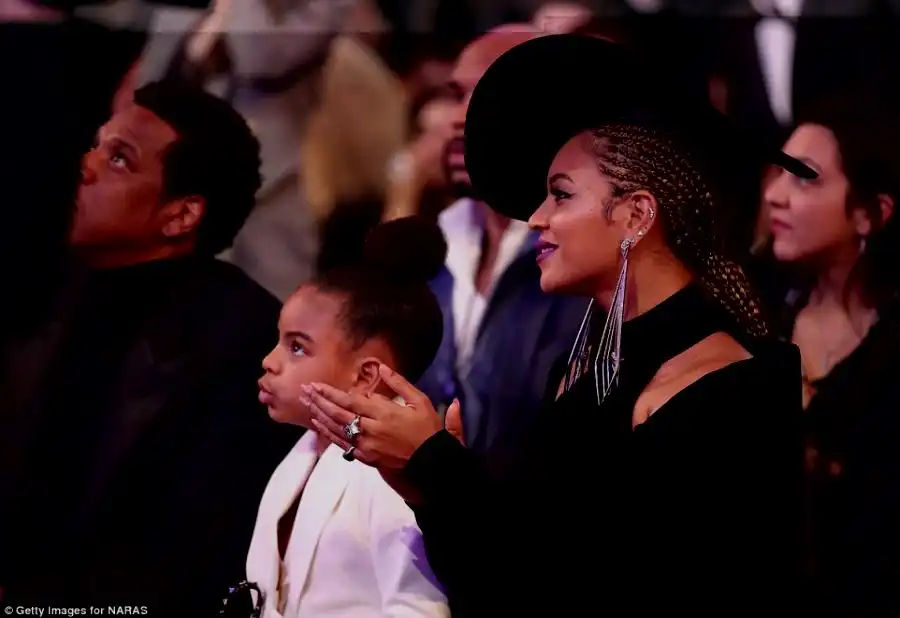 Cheering section: Beyonce clapped along to one of the performances as adorable daughter Blue was drawn to the stage