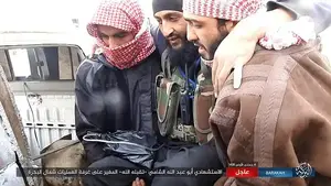 Terrorists: The man is seen being carried by two other fighters into a nearby vehicle