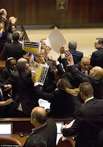 Members of the Joint List coalition of Arab parties held up placards in protest at Pence's visit 