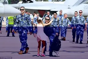 Children sprinted across the tarmac to greet the returning officers from their long stint abroad