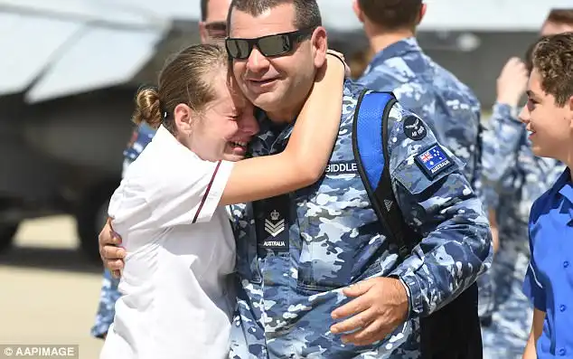 There were abundant tears as children welcomed back their fatherswho had been fighting IS in Iraq and Syria  