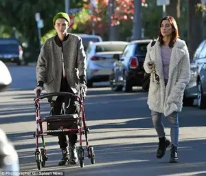Walk it out: Ruby wore a pair of sturdy black combat boots as she pushed a pink-and-black walker through the street after her appointment